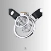 CC24 chastity cage paired with a flat wearable ring and a leather strap for a secure and stylish fit.