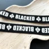 strap details with letters
