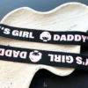 strap design with daddy and a girl image