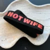 strap of the sign 'hot wife'