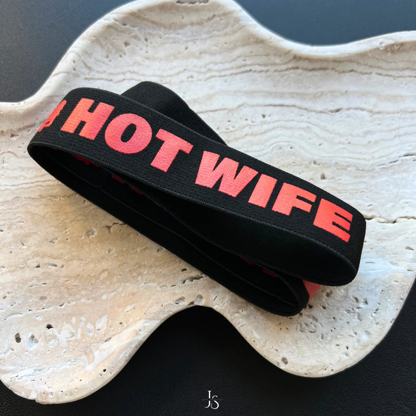 strap of the sign 'hot wife'