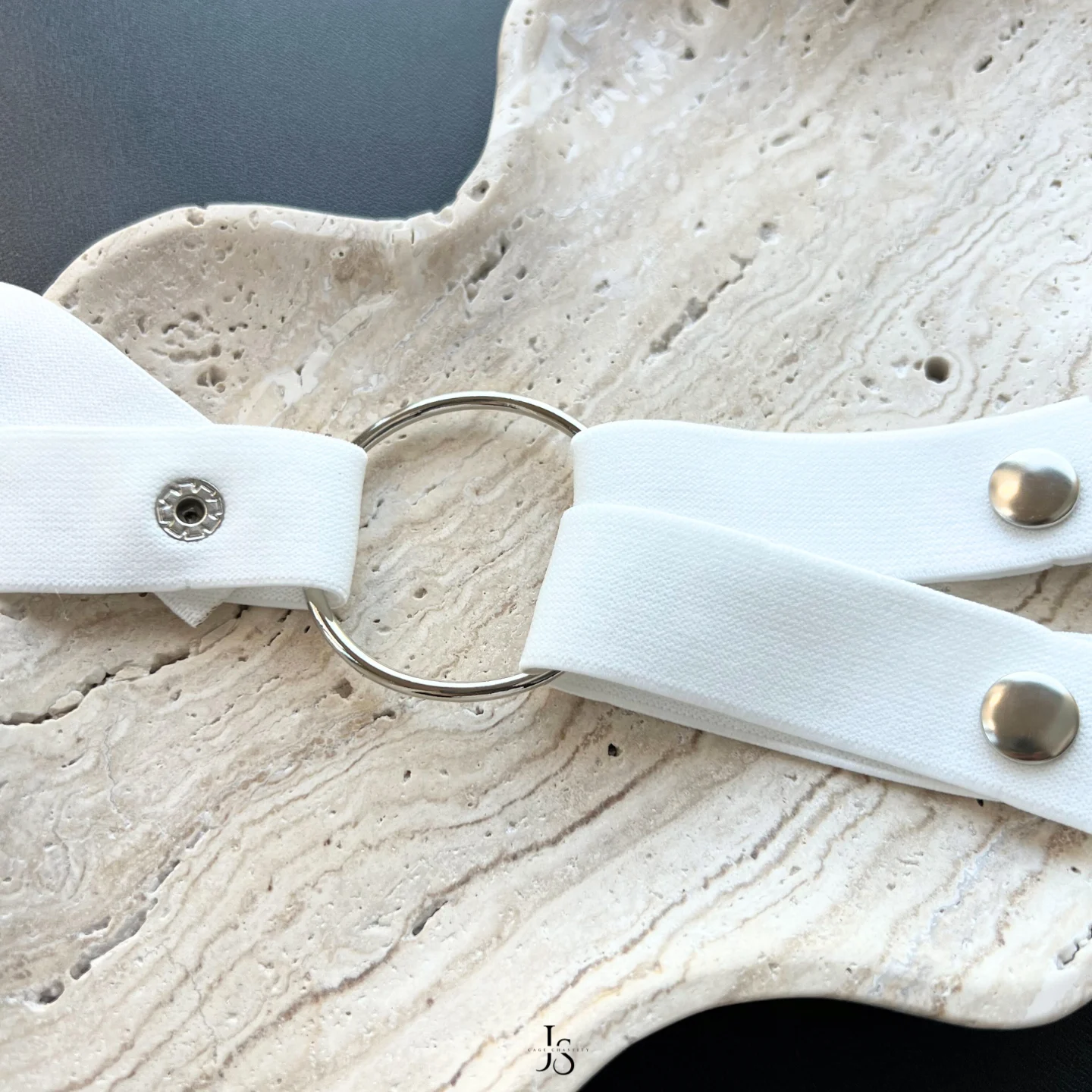 strap tied to a metal ring