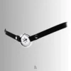 Worn with leather strap, demonstrating secure positioning against the body