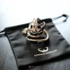 small tiger cage with keys, reflecting the crown logo