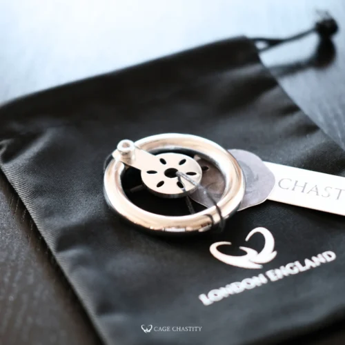 flat plate metal cage on the CC bag with cagechastity tag