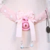the pink bowtie on the cage with lace strap attached