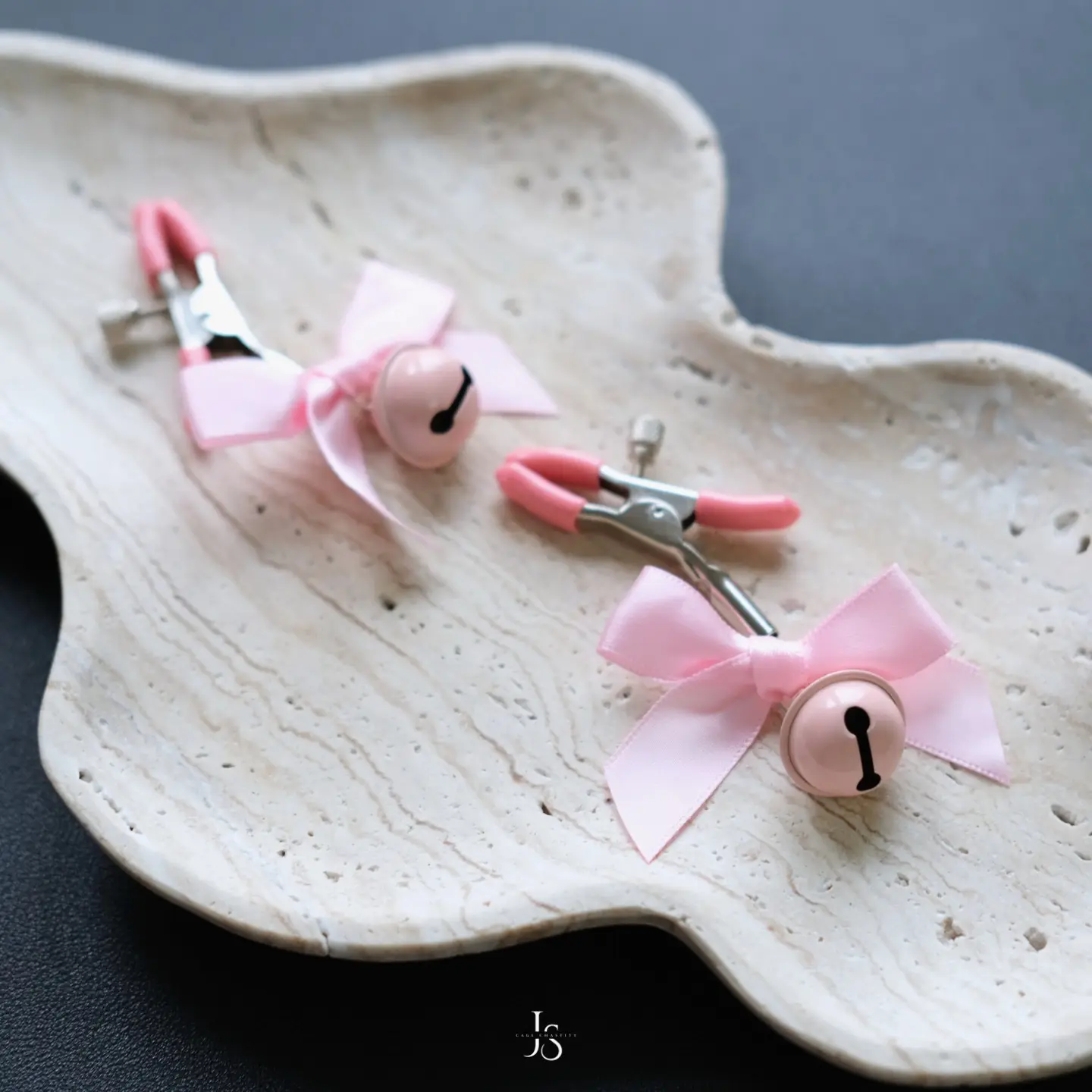 two clamps on a plate