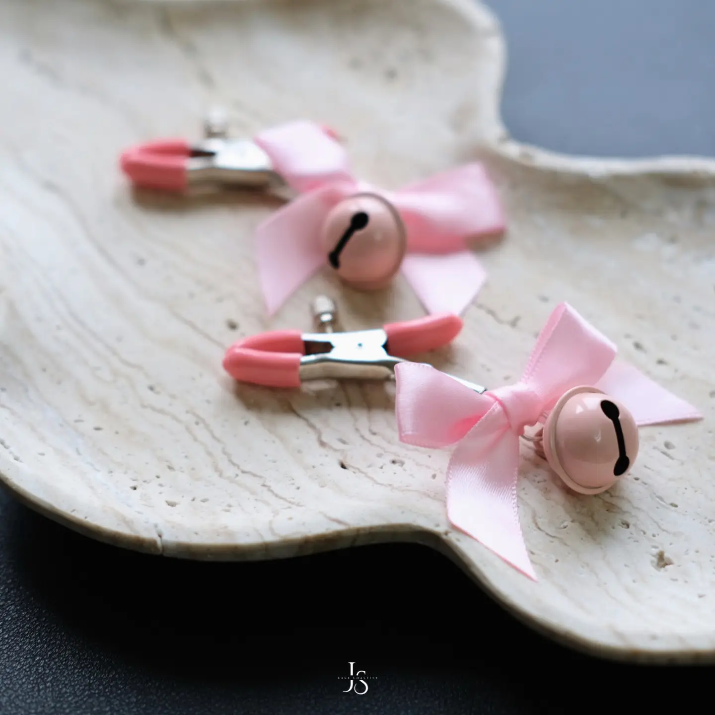 two clamps with bells