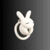 a white rabbit design, closed eyes, holding hands