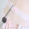 ribbon decorations on the white lace strap with cc tag