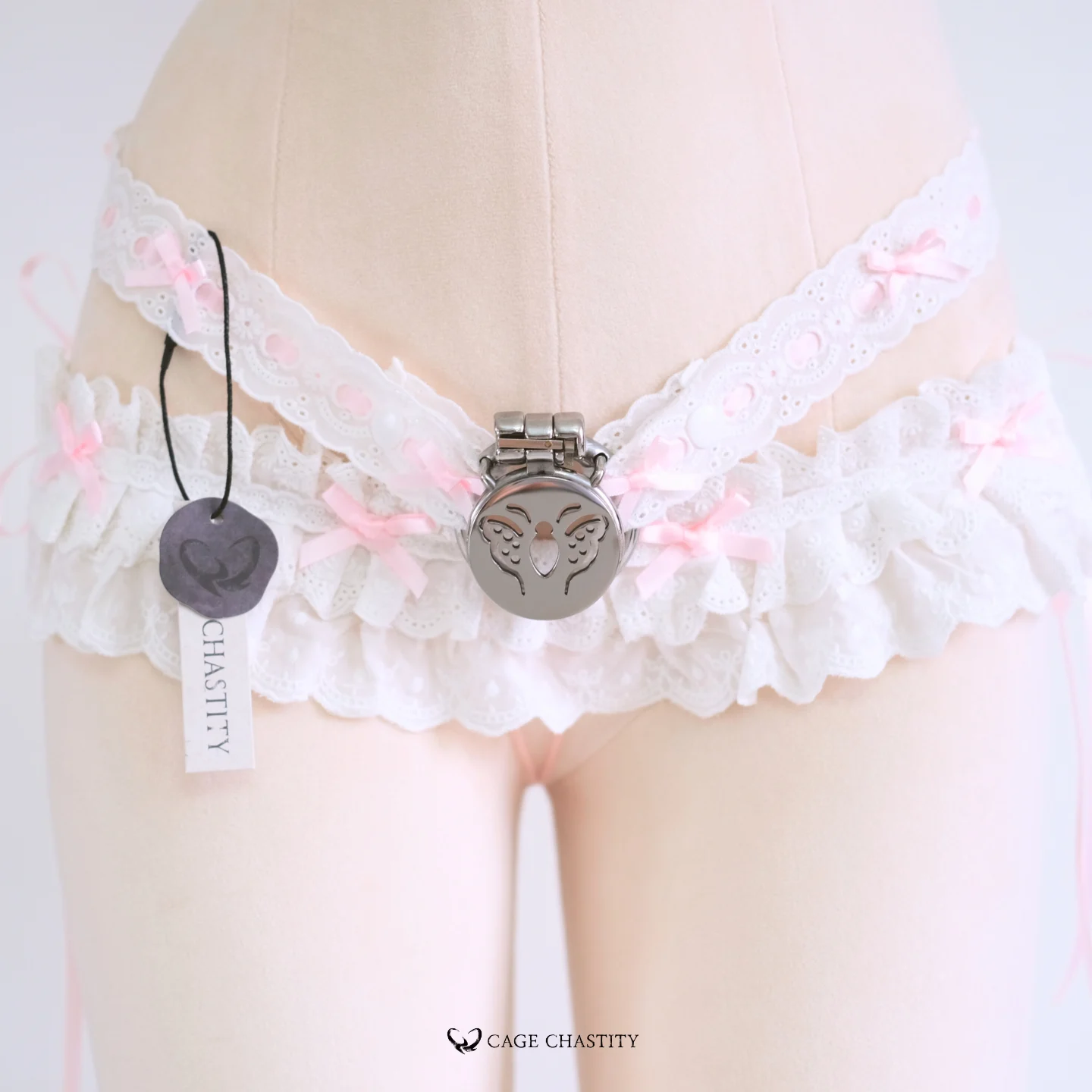 Front-close detail of pink tie and waistband edge