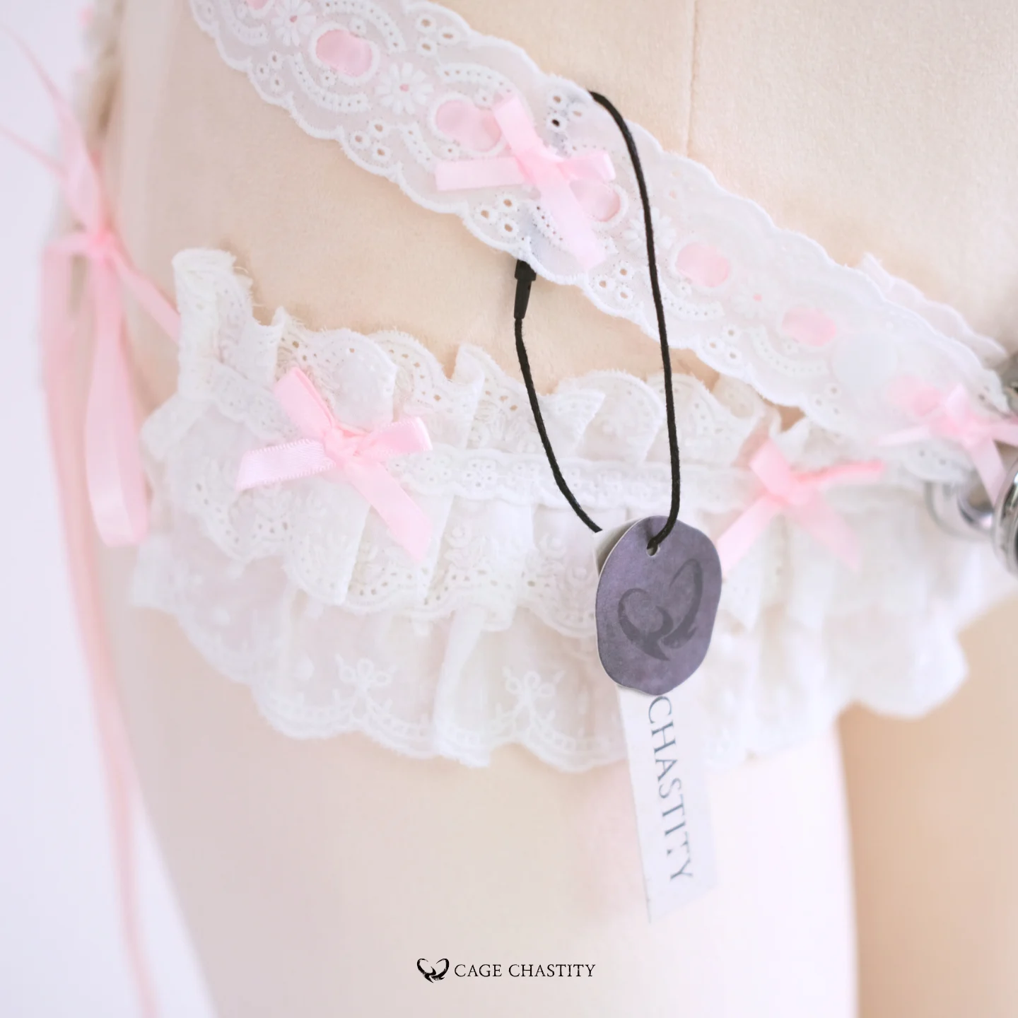 Zoomed-in image of pink bow at back fastening