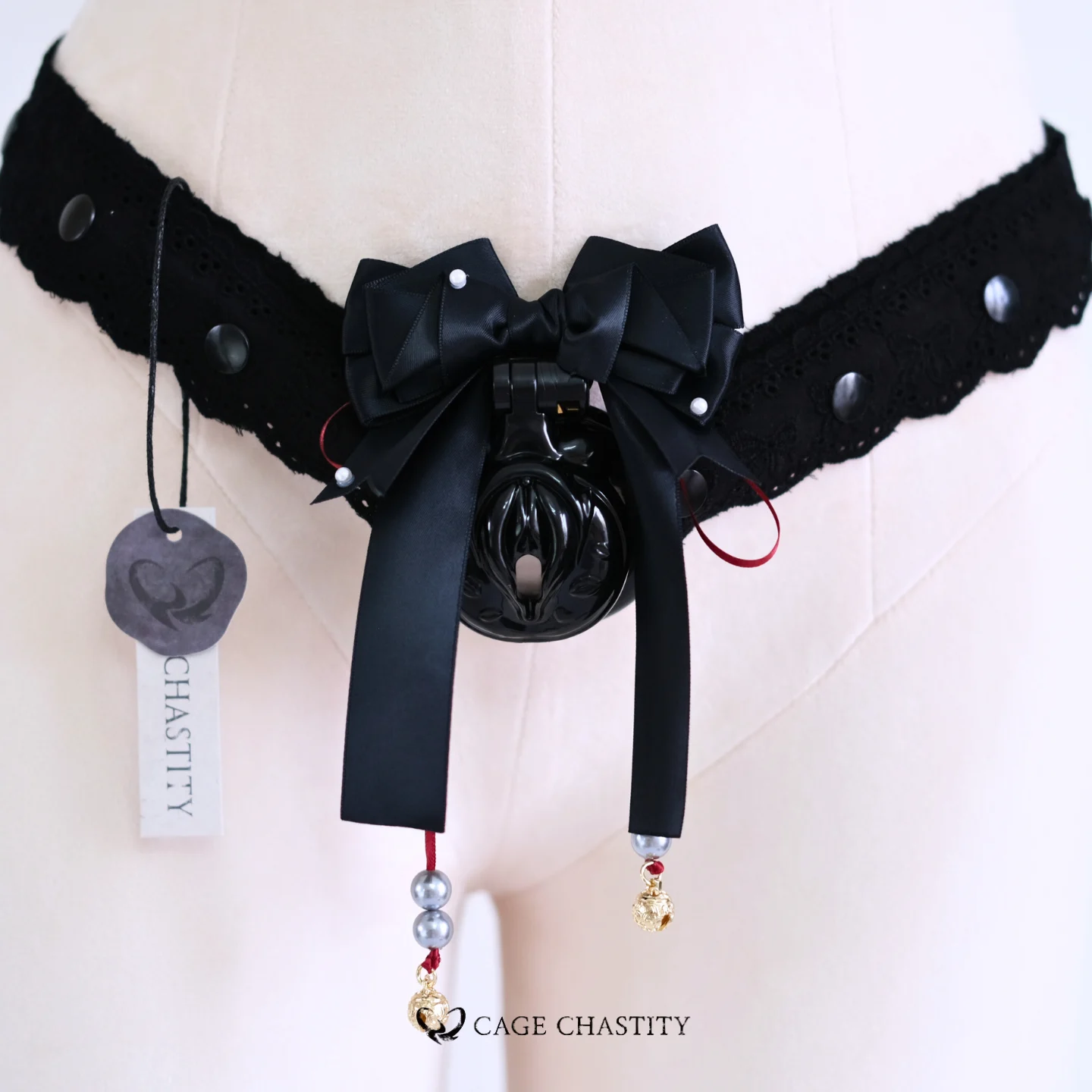 the black cage with the black lace strap