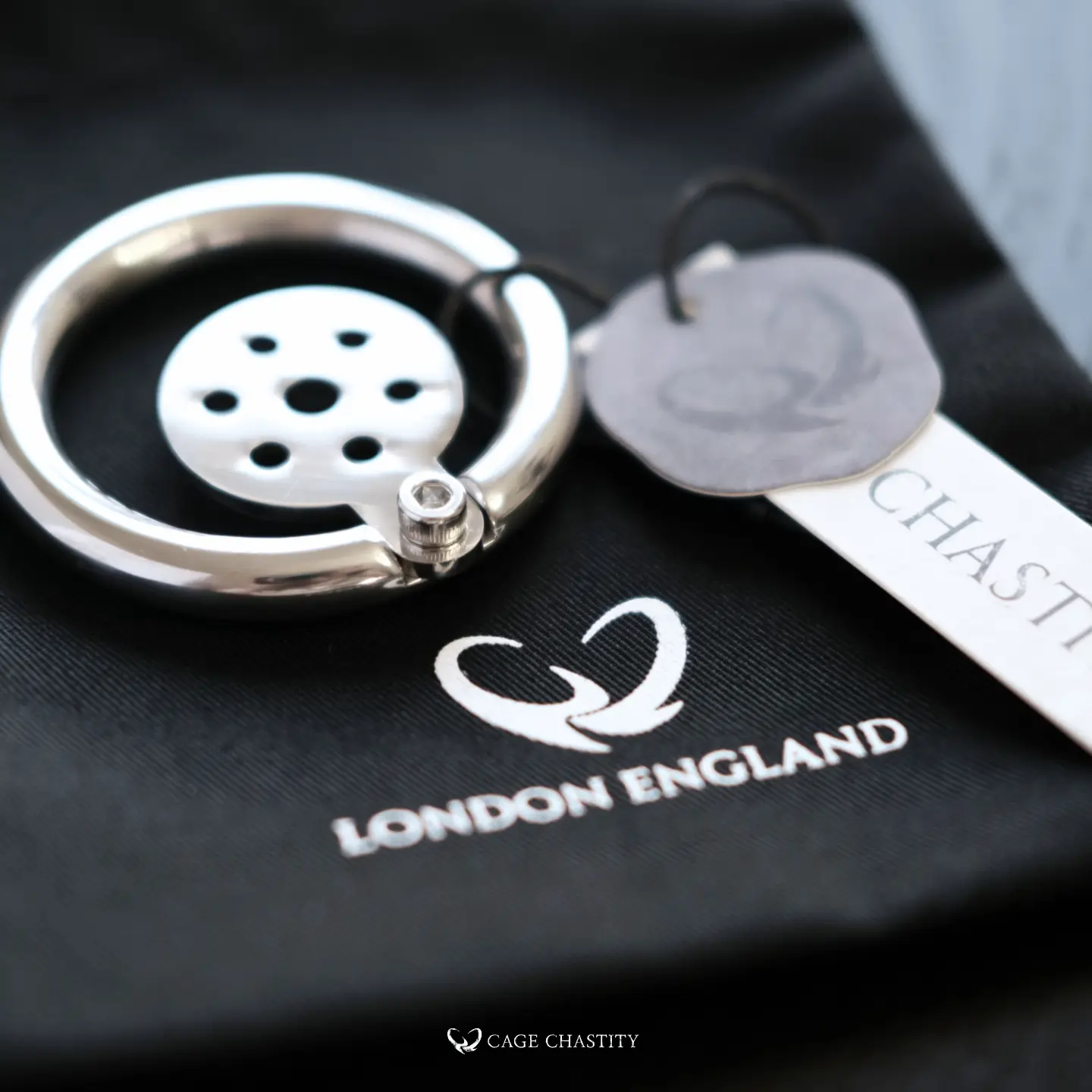 the silver cage on the black bag