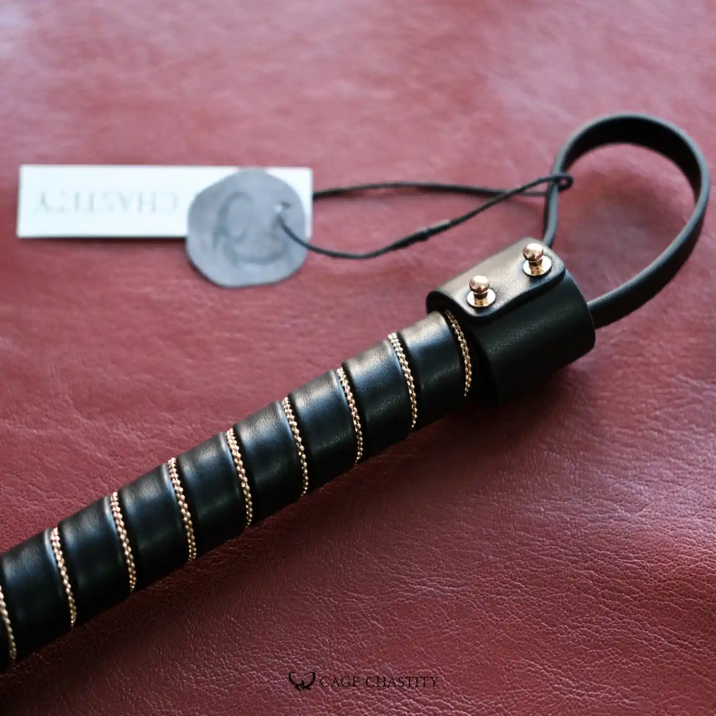 the handle with firm leather wrapped with gold metal buckles