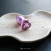 the pink heart butt plug on a wood plate