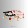 pink and black collar with different gems