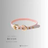 the blush pink color of the leather collar