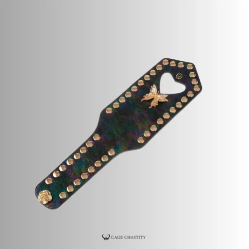 the vintage color of the leather paddle with a gold butterfly decoration
