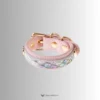 the rainbow color and the fish skin pattern of the mermaid cuff, reminder of the rainbow of sea