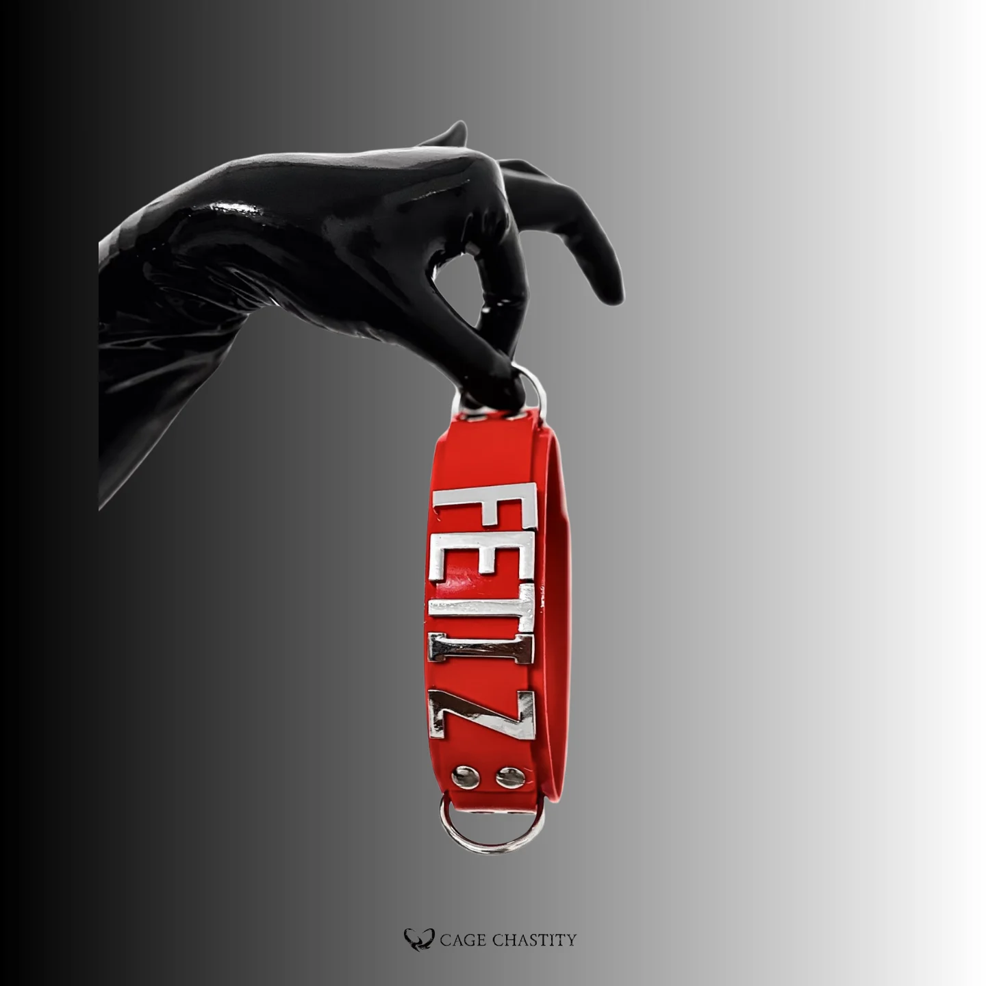 a hand in black silicone glove holding the red collar