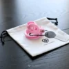 the dual arc ring with the xxxxs size pink cobra cage