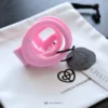 the inside of the pink cobra cage