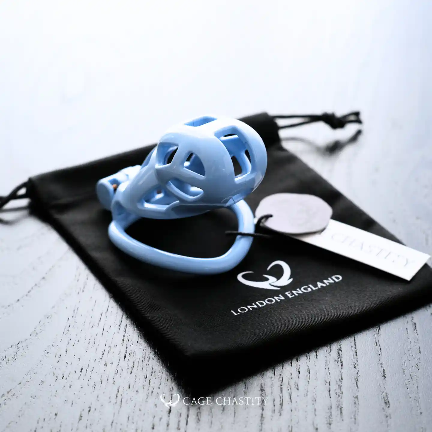 the side view of the blue cobra cage on black cc bag