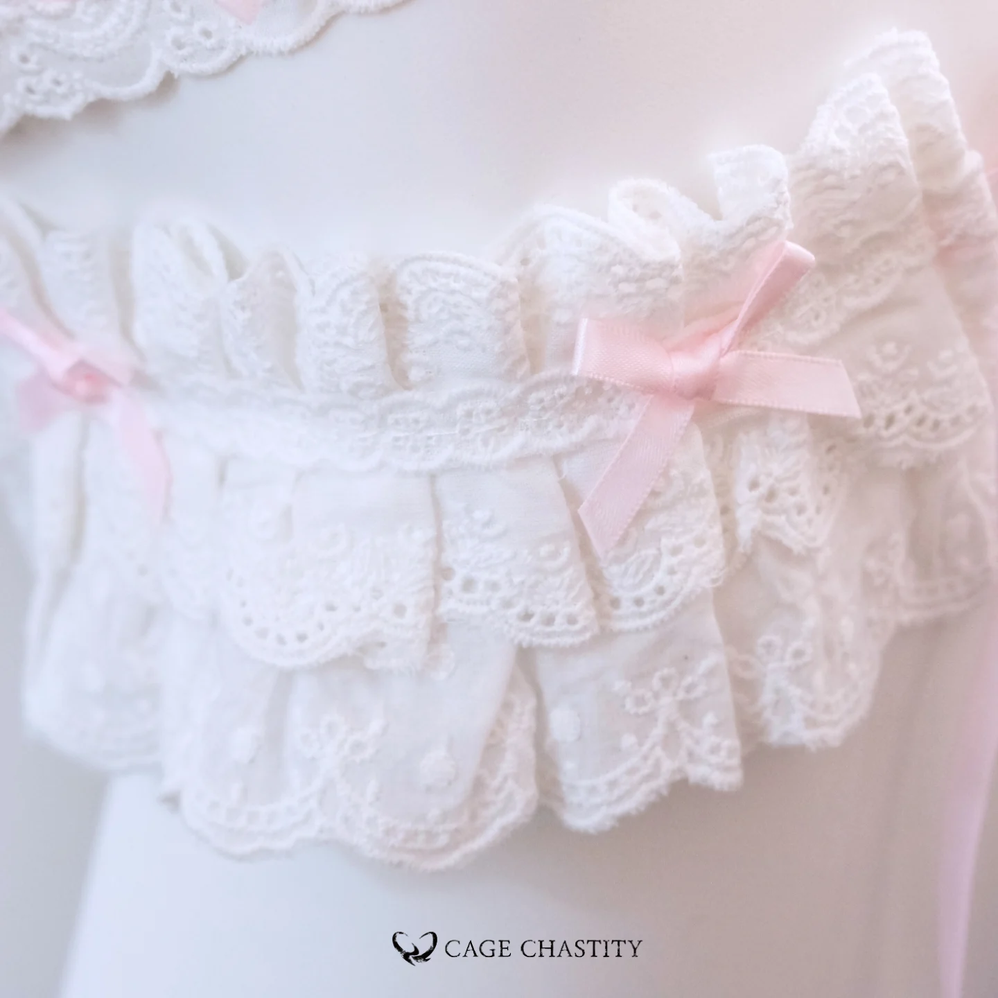 the white lace with pink bow