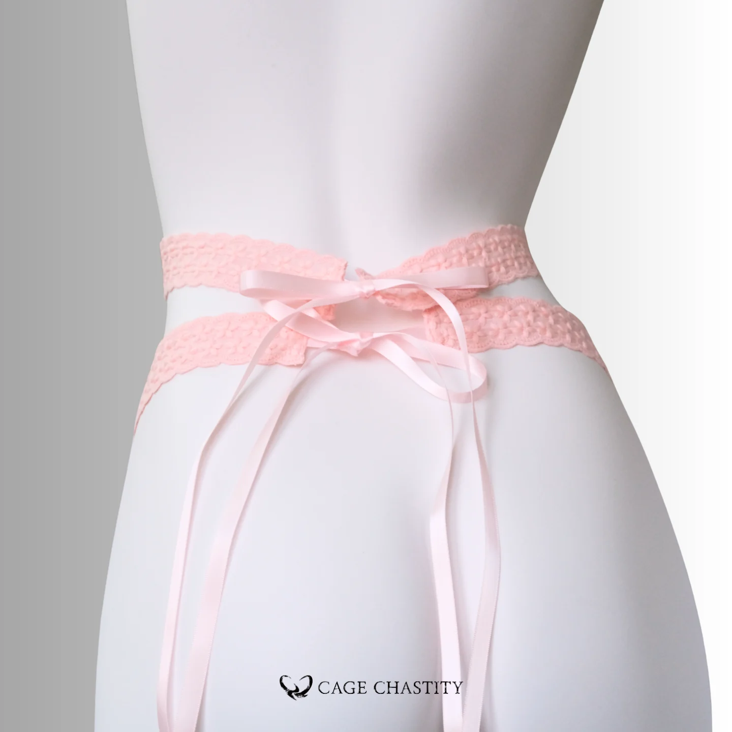 the cotton ribbon knot of the femboy harness