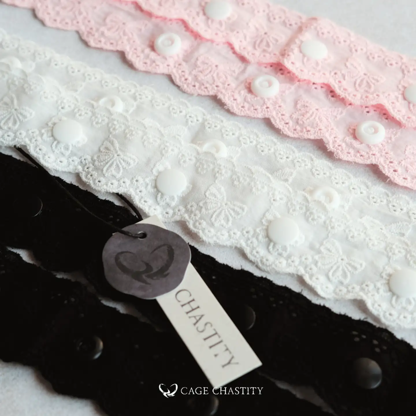 pink white and black strap with white lace