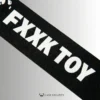 the printed letters saying fxxk toy