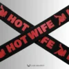 the printed symbol and letters of the hot wife strap
