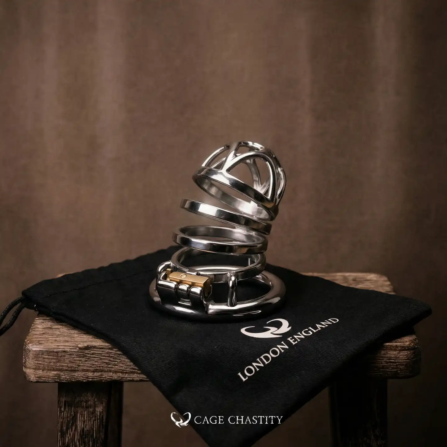 live pic of the cck1174 long term cage, on a cc black bag and over a wooden stool