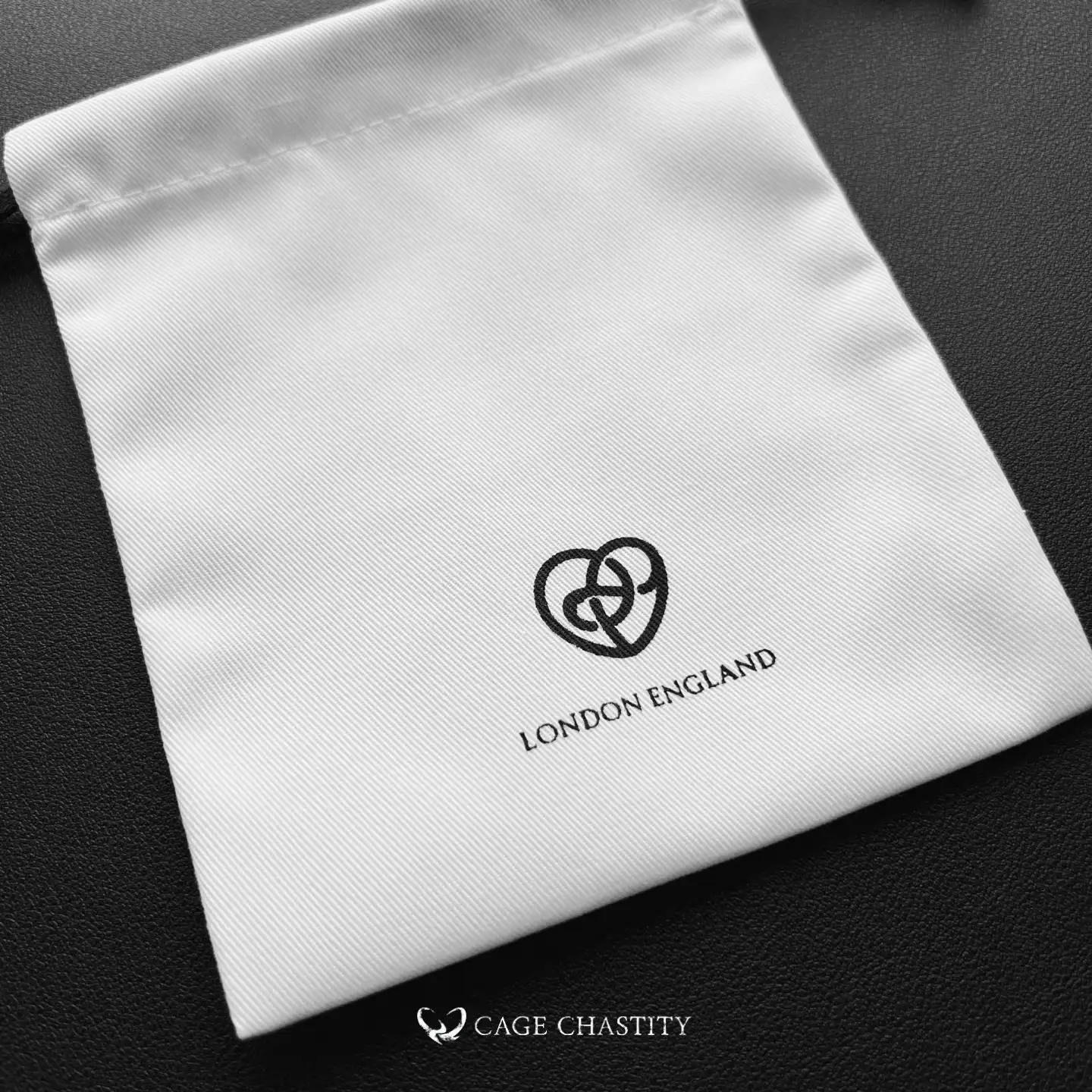 white chastity bag with old cc heart logo